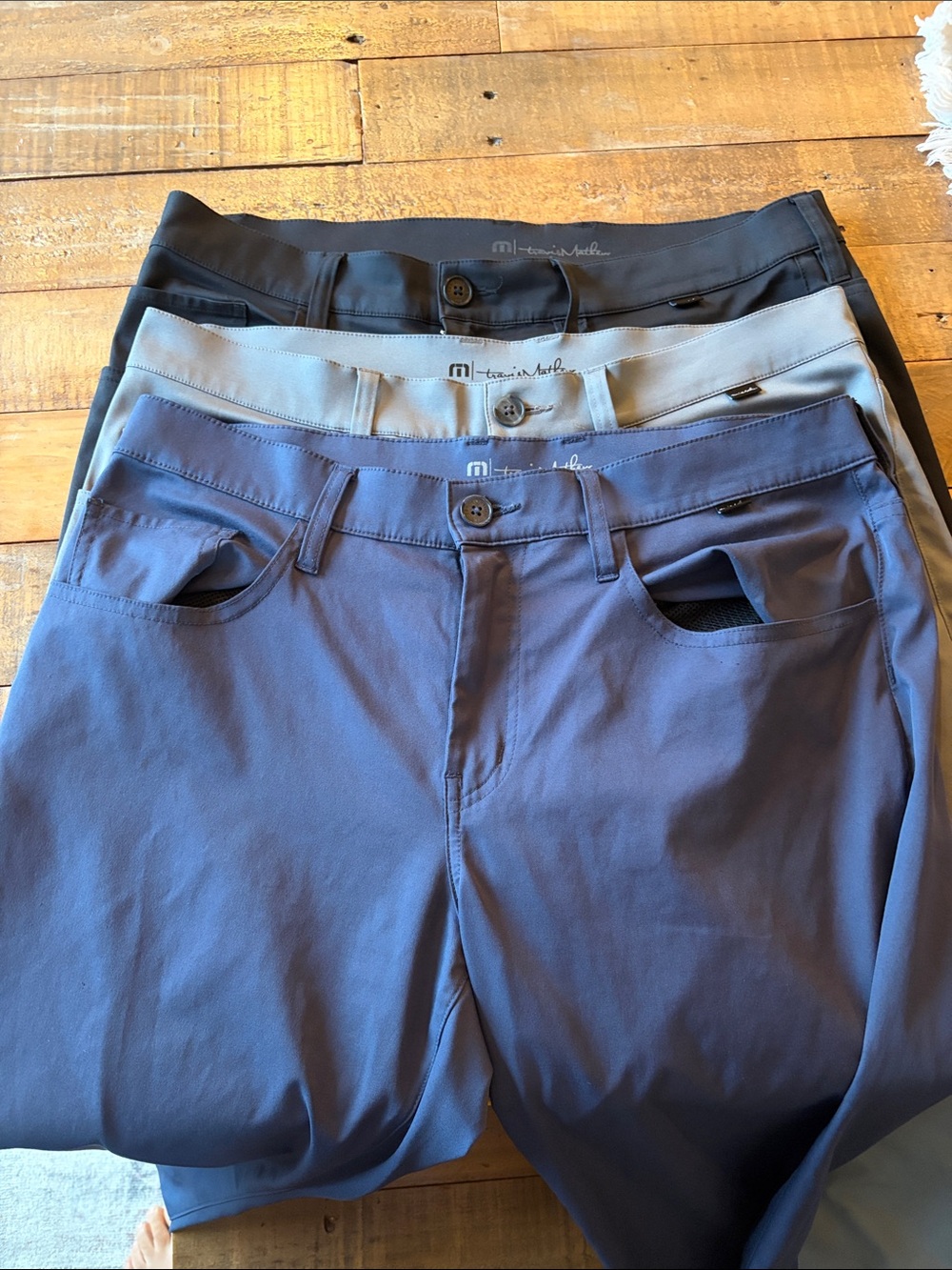 Travis Mathew Golf Pants in Blue, Light Gray, and Black. $100 total for all 3.
